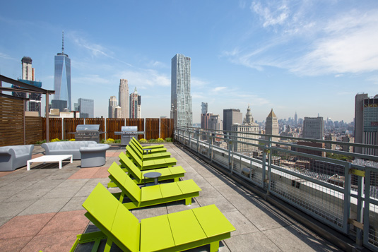 Amenities gallery - 2 of 8 - rooftop with views and lounge chairs at 200 Water St.