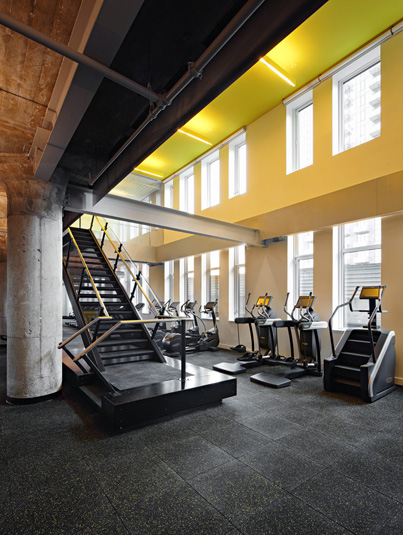 Amenities gallery - 4 of 7 - Gym featuring stair-masters and large double windows at Eagle Lofts